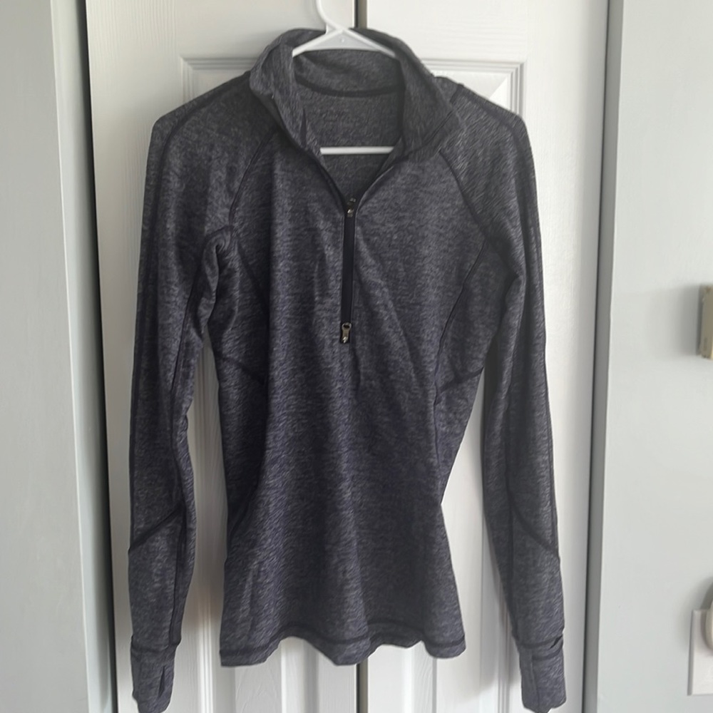Lululemon 1/4 running shirt. Great for base layer with hand warmer in sleeves.